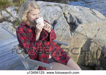Young Woman relaxing on jetty. View Large Photo Image Stock Photography - Young Woman relaxing on jetty.. Fotosearch