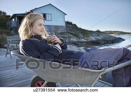 Young Woman relaxing. View Large Photo Image Picture - Young Woman relaxing.. Fotosearch