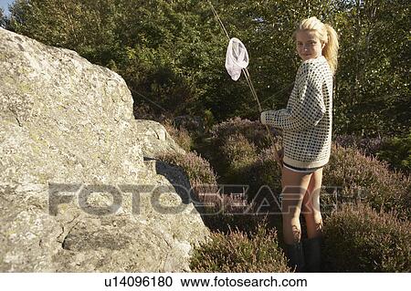 Young woman walking in nature. View Large Photo Image Stock Image - Young woman walking in nature.. Fotosearch
