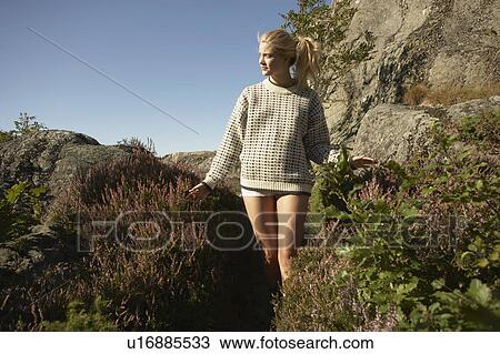 Young woman walking in nature. View Large Photo Image Stock Image - Young woman walking in nature.. Fotosearch