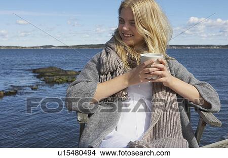 Young Woman drinking Coffee or Tea. View Large Photo Image Picture - Young Woman drinking Coffee or Tea.. Fotosearch