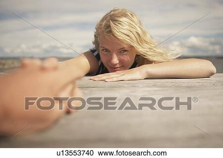 Young Woman sitting outdoors. View Large Photo Image Stock Image - Young Woman sitting outdoors.. Fotosearch