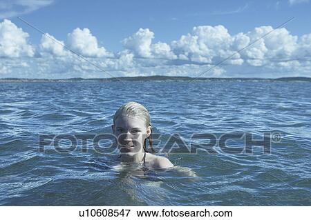 Young Woman Swimming in the Sea. View Large Photo Image Stock Photo - Young Woman Swimming in the Sea.. Fotosearch