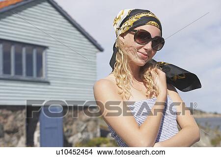 Young woman with head scarf. View Large Photo Image Picture - Young woman with head scarf.. Fotosearch