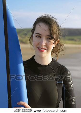 Portrait of a brunette female surfer. View Large Photo Image Stock Photo - Portrait of a brunette female surfer.. Fotosearch