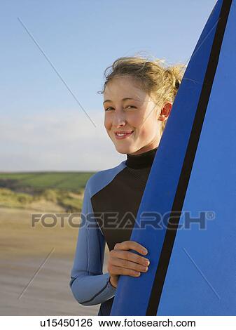 Portrait of a brunette female surfer. View Large Photo Image Stock Photograph - Portrait of a brunette female surfer.. Fotosearch
