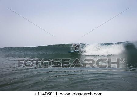 Man surfing a wave. View Large Photo Image Stock Image - Man surfing a wave.. Fotosearch