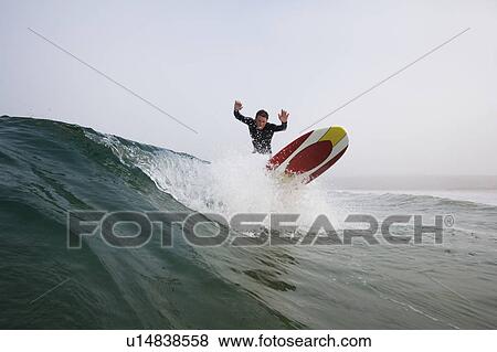 Man surfing a wave. View Large Photo Image Stock Photo - Man surfing a wave.. Fotosearch