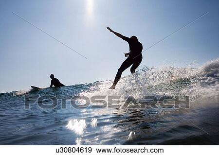 Two men surfing. View Large Photo Image Stock Photo - Two men surfing.. Fotosearch
