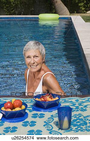 Woman in swimming pool. View Large Photo Image Picture - Woman in swimming pool.. Fotosearch