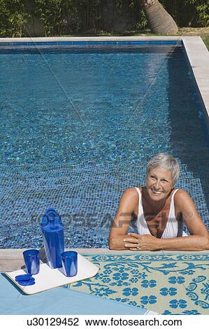 Woman in swimming pool. View Large Photo Image Stock Image - Woman in swimming pool.. Fotosearch