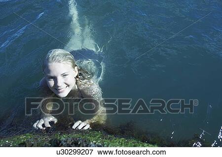Young Woman Swimming in the Sea. View Large Photo Image Stock Photo - Young Woman Swimming in the Sea.. Fotosearch
