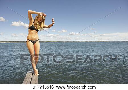 Young woman on diving platform. View Large Photo Image Stock Image - Young woman on diving platform.. Fotosearch