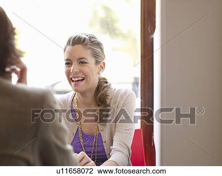 Stock Image - Female teen in cafe. Fotosearch