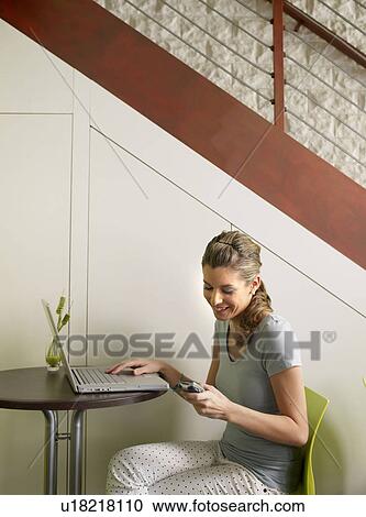 Female teen in cafe with laptop, mobile View Large Photo Image Stock Image - Female teen in cafe with laptop, mobile. Fotosearch