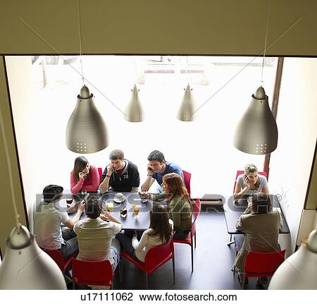 Group of teenagers in cafe View Large Photo Image Stock Image - Group of teenagers in cafe. Fotosearch