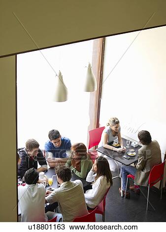 Group of teenagers in cafe View Large Photo Image Stock Image - Group of teenagers in cafe. Fotosearch