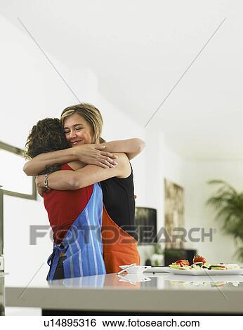 Stock Photograph - Mother and daughter embracing. Fotosearch