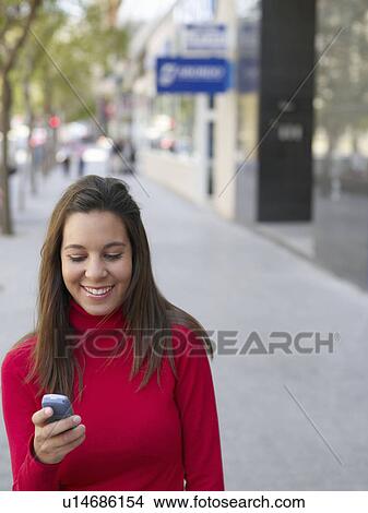 Portrait of a female teenager on mobile View Large Photo Image Picture - Portrait of a female teenager on mobile . Fotosearch