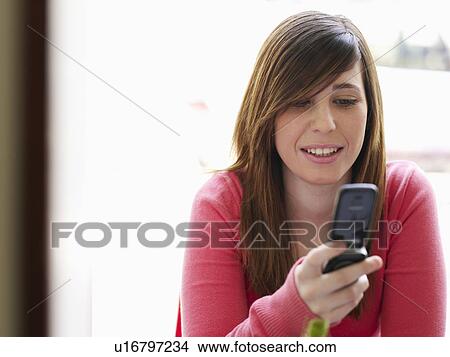 Picture - Portrait of teenage female with mobile . Fotosearch