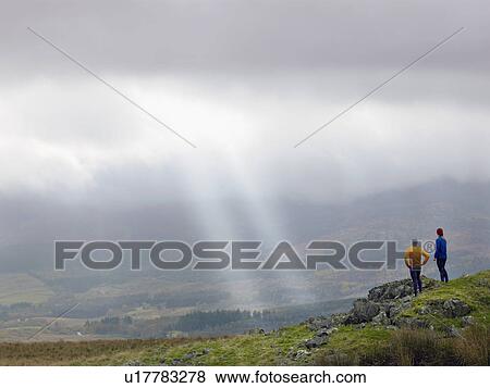 Couple in mountain landscape. View Large Photo Image Stock Photo - Couple in mountain landscape.. Fotosearch