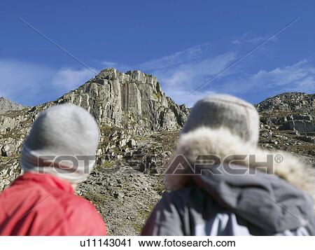 Stock Image - Couple looking up.. Fotosearch