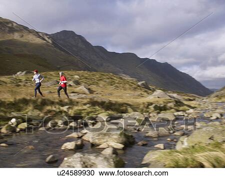 Stock Image - Couple running.. Fotosearch