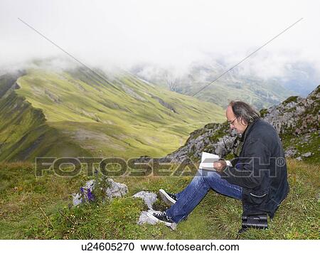Man drawing a picture of a mountain. View Large Photo Image Stock Image - Man drawing a picture of a mountain.. Fotosearch