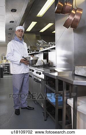 Chef holding bowl in his kitchen View Large Photo Image Stock Image - Chef holding bowl in his kitchen. Fotosearch