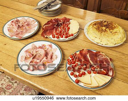Five plates of cooked meat, cheese and tortilla on dining table View Large Photo Image Stock Photograph - Five plates of cooked meat, cheese and tortilla on dining table. Fotosearch