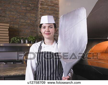 Pizza chef in front of oven View Large Photo Image Stock Photo - Pizza chef in front of oven. Fotosearch