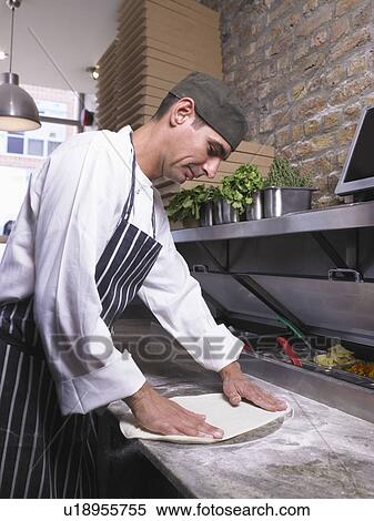 Pizza chef preparing pizza dough View Large Photo Image Stock Photography - Pizza chef preparing pizza dough. Fotosearch