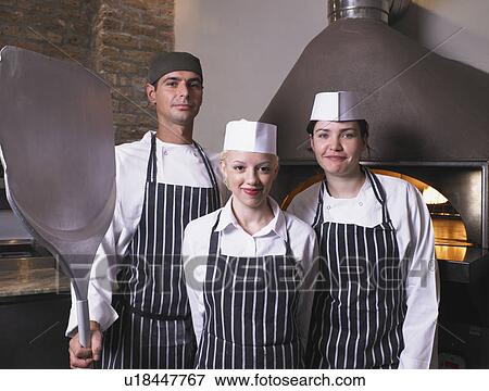 Pizza chefs in front of oven View Large Photo Image Stock Photo - Pizza chefs in front of oven. Fotosearch