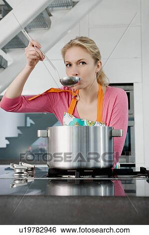 Portrait of a woman cooking. View Large Photo Image Stock Photograph - Portrait of a woman cooking.. Fotosearch