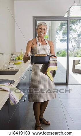 Woman holding baking dish. View Large Photo Image Stock Image - Woman holding baking dish.. Fotosearch