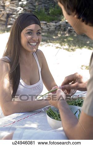 Young couple preparing fresh green beans View Large Photo Image Stock Image - Young couple preparing fresh green beans. Fotosearch