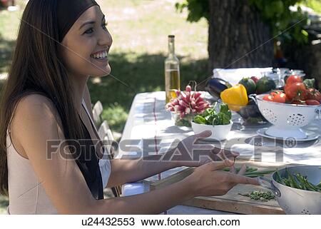 Young woman preparing fresh green beans View Large Photo Image Stock Image - Young woman preparing fresh green beans. Fotosearch