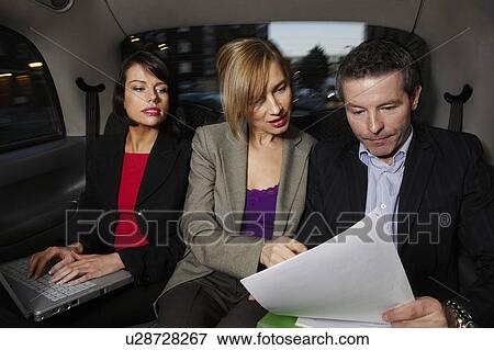 Three people in London Taxi View Large Photo Image Stock Photo - Three people in London Taxi. Fotosearch