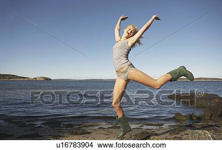 Young Woman in Wellingtons. View Large Photo Image Picture - Young Woman in Wellingtons.. Fotosearch