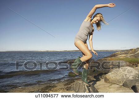 Young Woman in Wellingtons. View Large Photo Image Stock Photo - Young Woman in Wellingtons.. Fotosearch