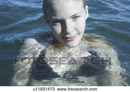 Stock Image - Young Woman Swimming in the Sea.. Fotosearch