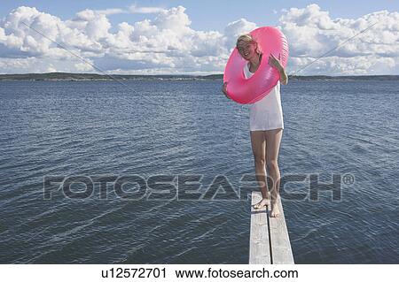 Young woman with swimming ring. View Large Photo Image Stock Image - Young woman with swimming ring.. Fotosearch