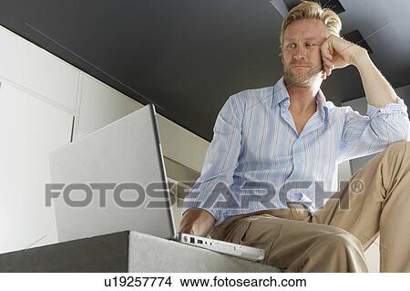 Businessman working from home. View Large Photo Image Picture - Businessman working from home.. Fotosearch