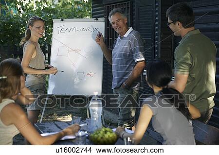 Businesspeople at a rural retreat. View Large Photo Image Picture - Businesspeople at a rural retreat.. Fotosearch