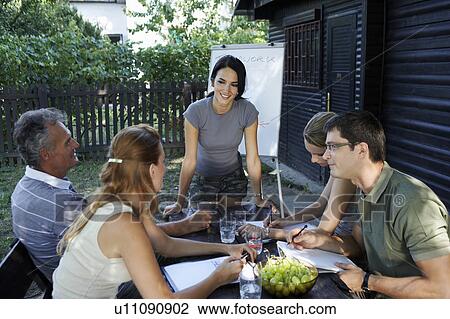 Businesspeople at a rural retreat. View Large Photo Image Stock Image - Businesspeople at a rural retreat.. Fotosearch