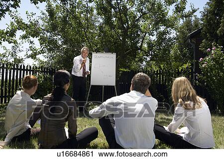 Businesspeople at a rural retreat. View Large Photo Image Stock Image - Businesspeople at a rural retreat.. Fotosearch