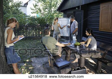 Businesspeople at a rural retreat. View Large Photo Image Stock Photo - Businesspeople at a rural retreat.. Fotosearch