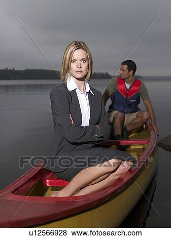 Businesswoman and man in kayak View Large Photo Image Stock Photo - Businesswoman and man in kayak. Fotosearch