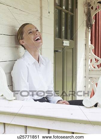 Businesswoman by country cottage View Large Photo Image Stock Image - Businesswoman by country cottage. Fotosearch