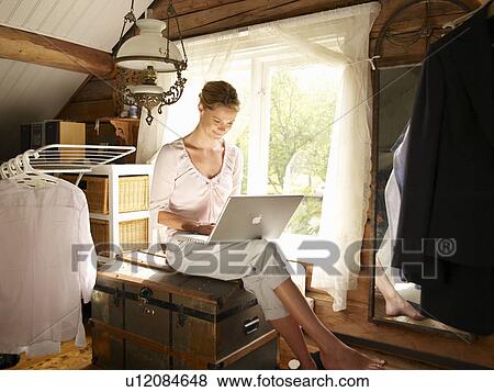 Stock Photo - Businesswoman working from home office. Fotosearch